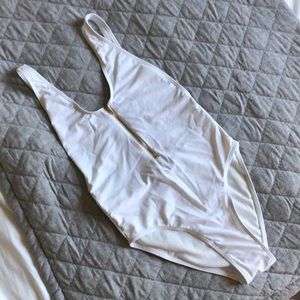 NWOT One-piece with zip front / backless